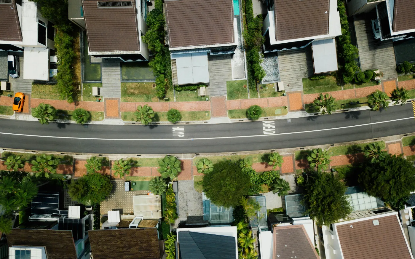 aerial photo of brown roof houses by CHUTTERSNAP courtesy of Unsplash.