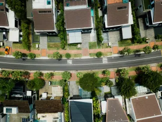 aerial photo of brown roof houses by CHUTTERSNAP courtesy of Unsplash.