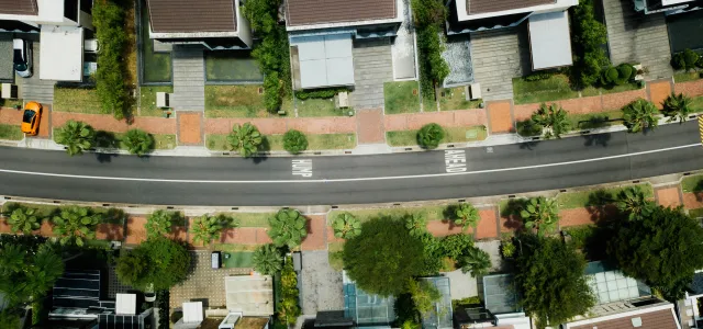 aerial photo of brown roof houses by CHUTTERSNAP courtesy of Unsplash.